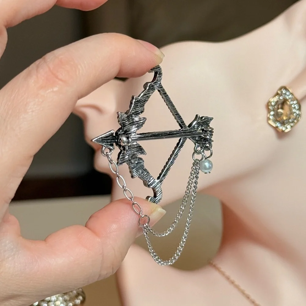 Elegant Silver Bow and Arrow Brooch